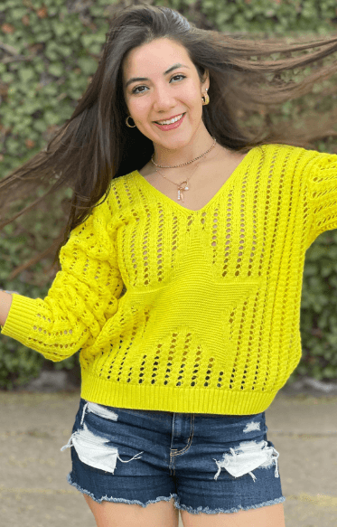Sueter cuello V hoyos y estrella